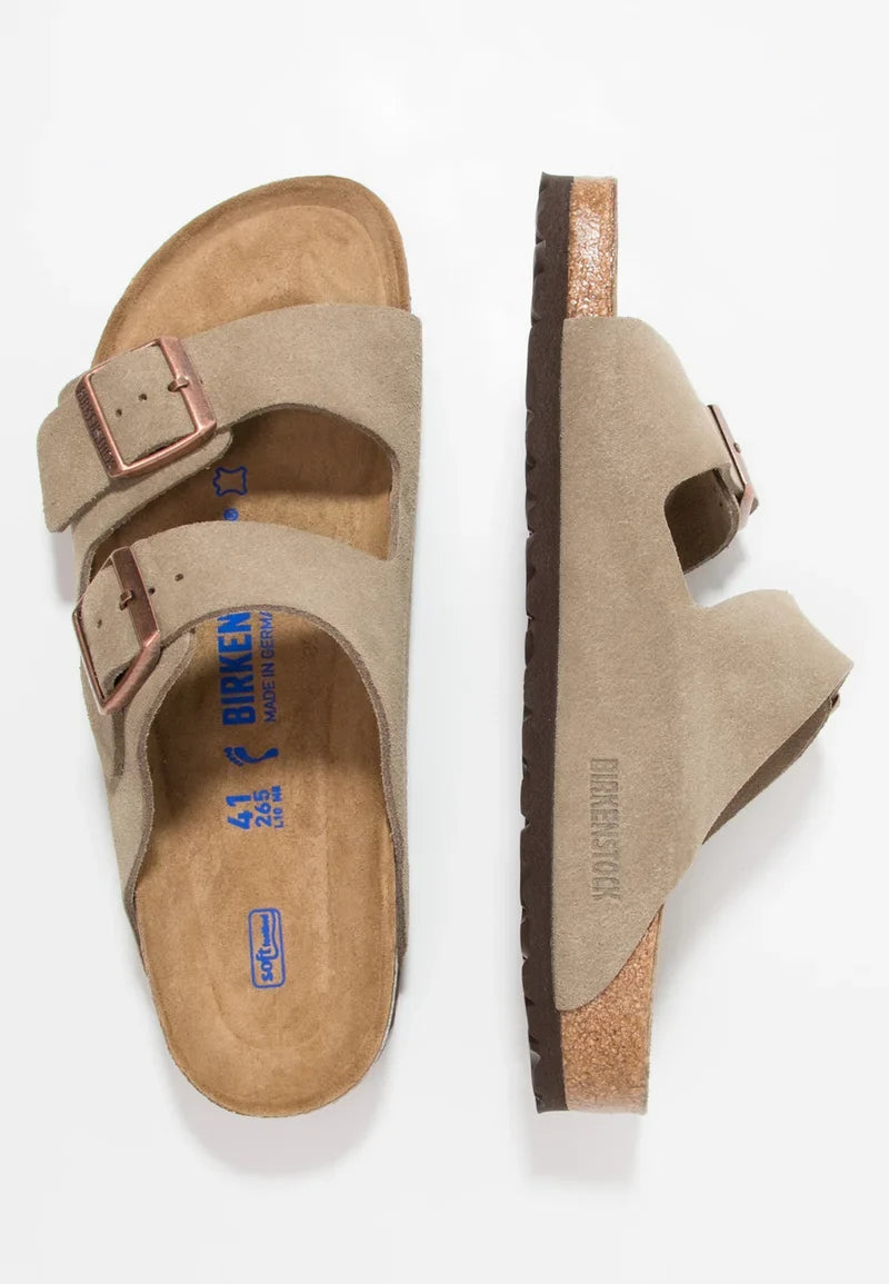 Beige sandal with brown sole on a white background