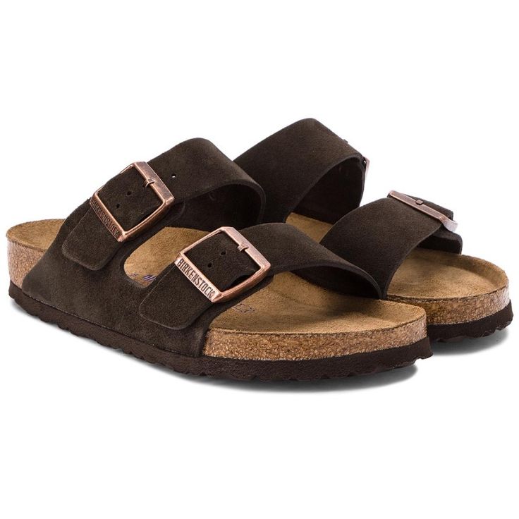 Pair of brown sandals with cork soles on a white background