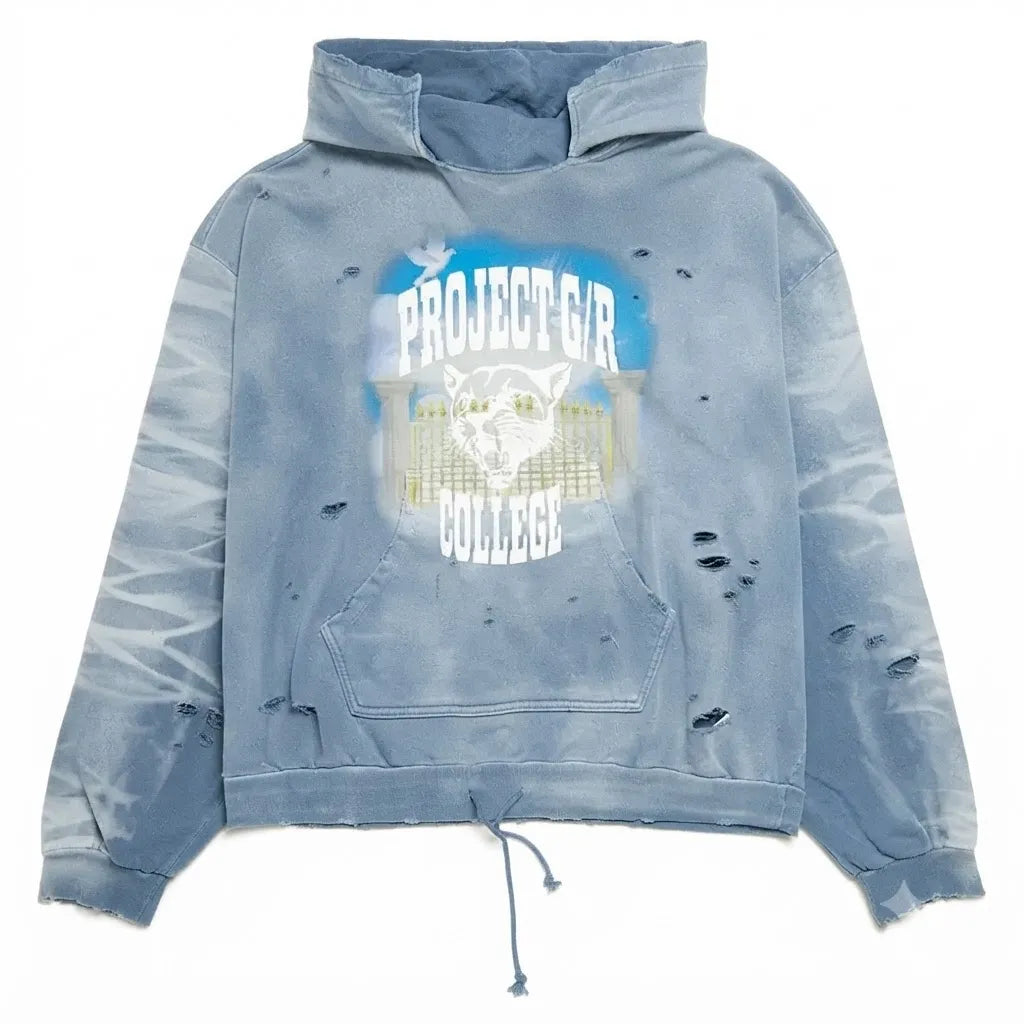 A light blue acid-wash distressed hoodie with a front graphic that reads 'PROJECT GIRL COLLEGE' with a raccoon illustration, shown on a plain white background.