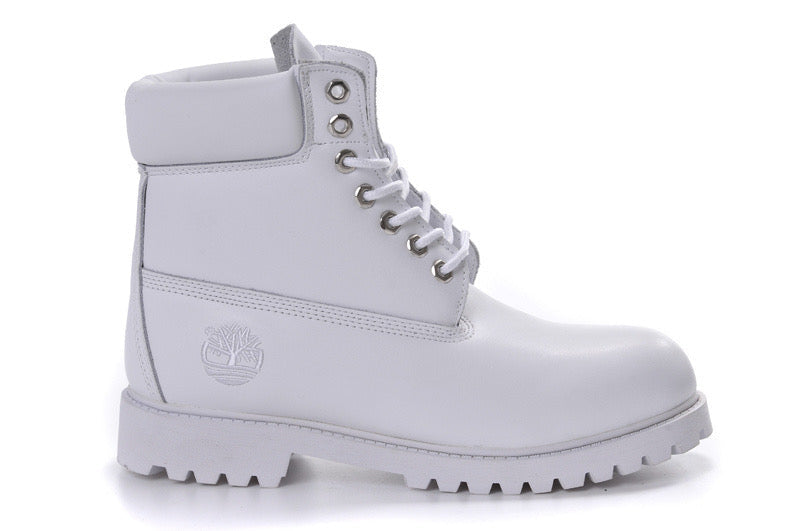A white Timberland lace-up boot with a white rubber sole and silver metal eyelets, shown from a side profile on a white background.
