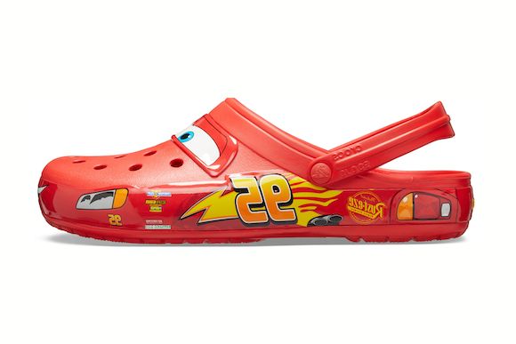 Red clog shoe with character design on a white background