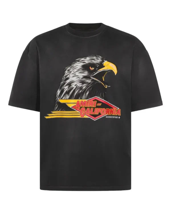 Black t-shirt with an eagle graphic and 'Amiri California' text on a white background