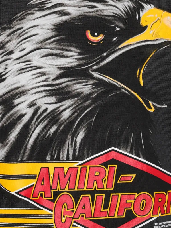 Close-up of an eagle's face with 'Amiri California' branding.