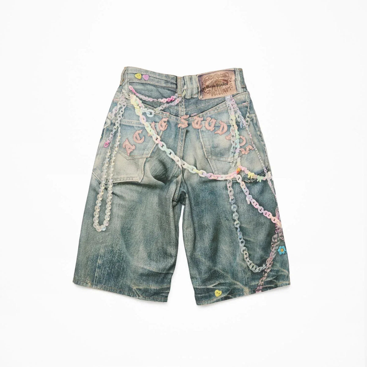 Denim shorts with chains on a white background