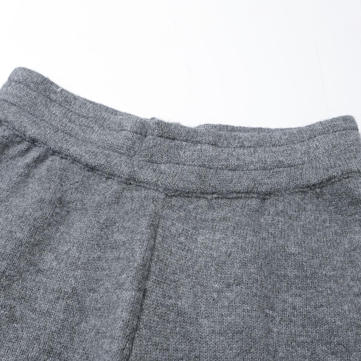 Close-up of gray sweatpants on a white background