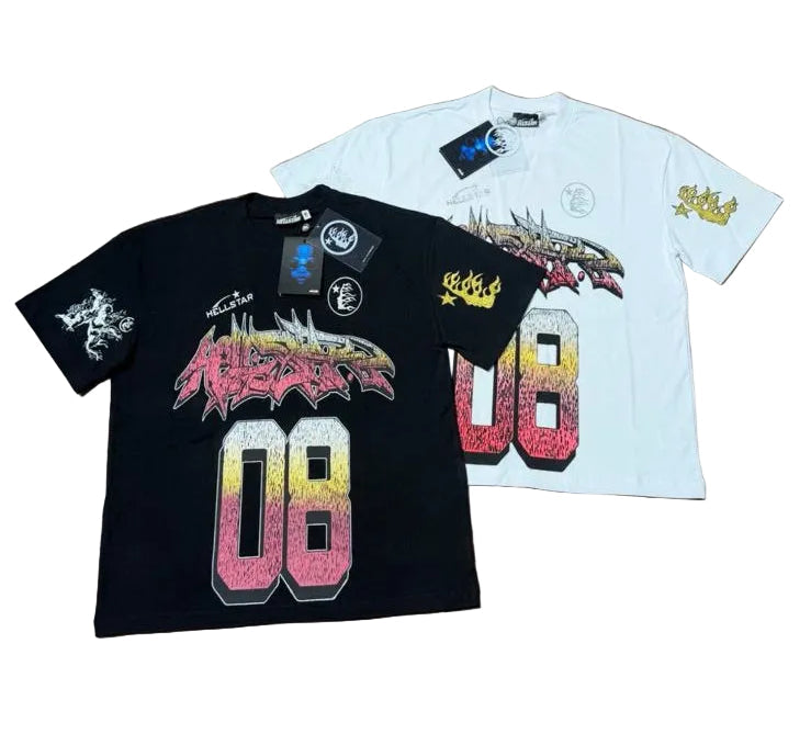 Two t-shirts, one black and one white, with graphic designs on a wooden surface.