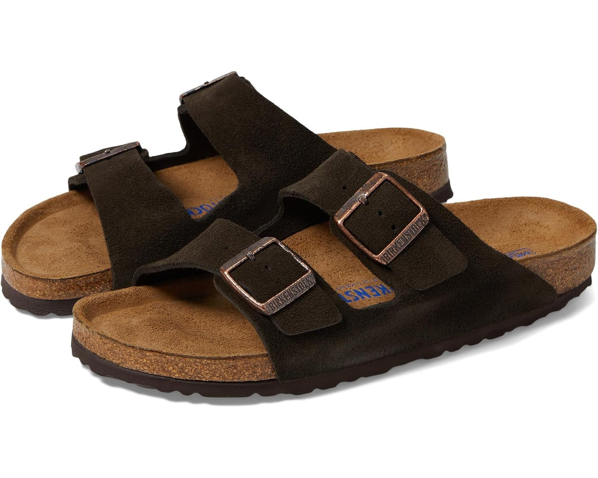 Brown sandals with cork-like soles on a white background