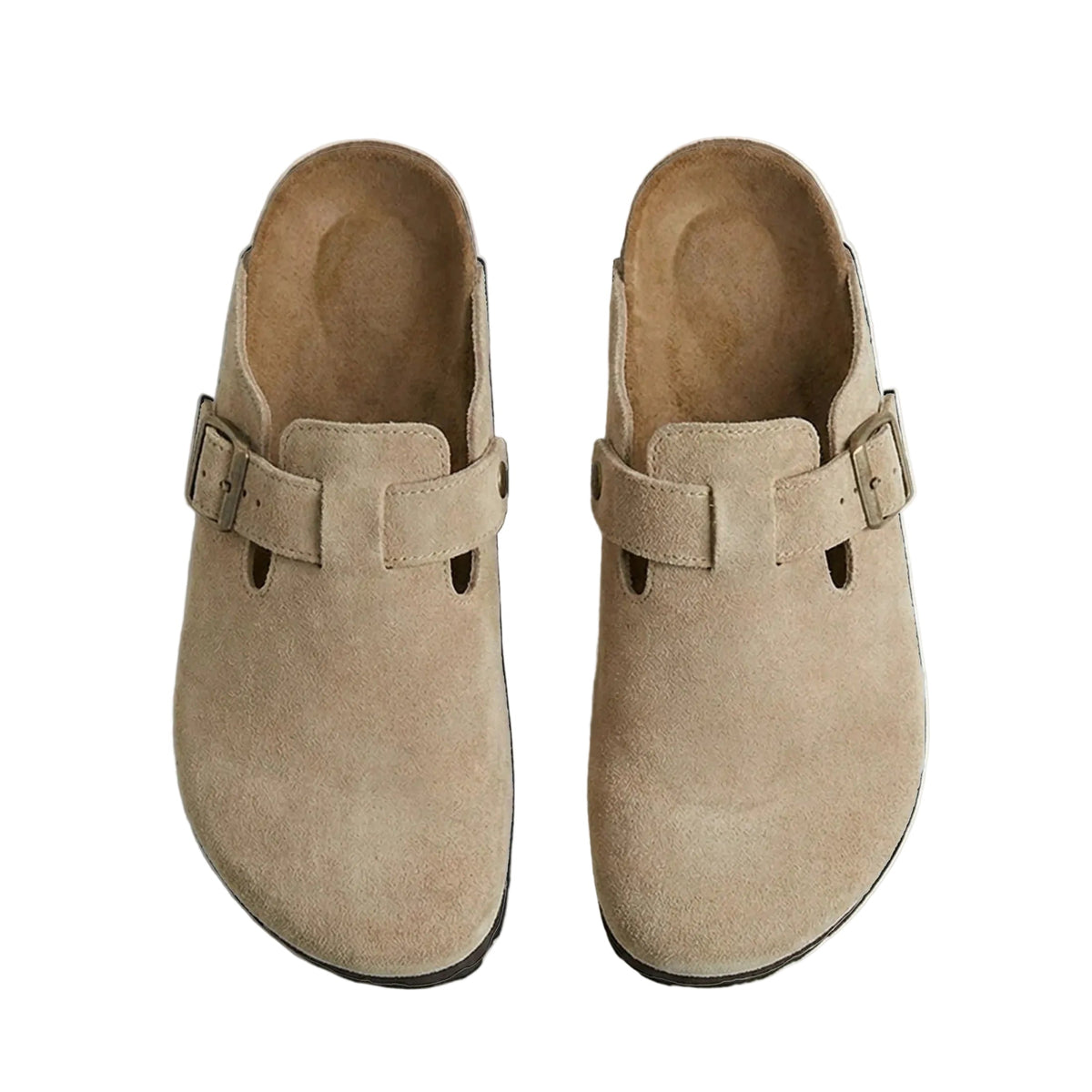 Pair of beige suede clogs on a light gray background