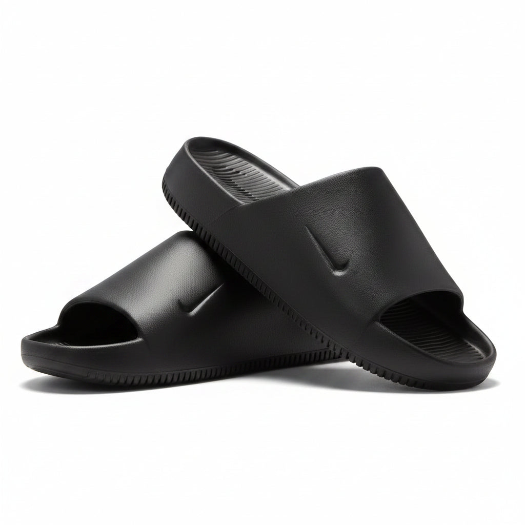 Black slides with a Nike logo on a light gray background