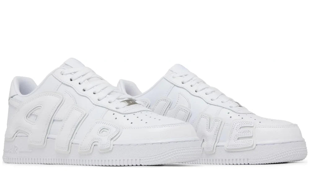 White sneakers with brand logo on a white background