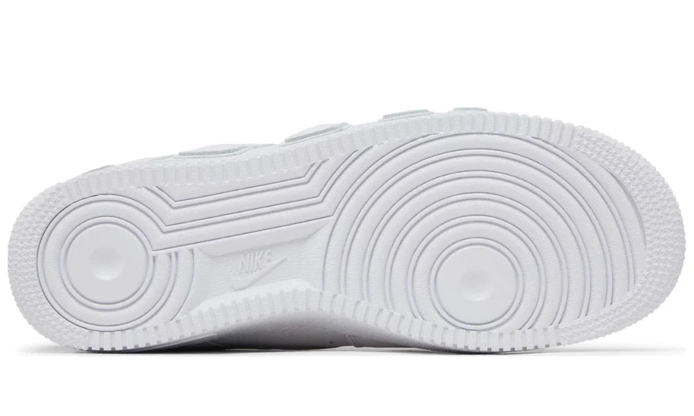White sneaker sole with tread pattern on a white background