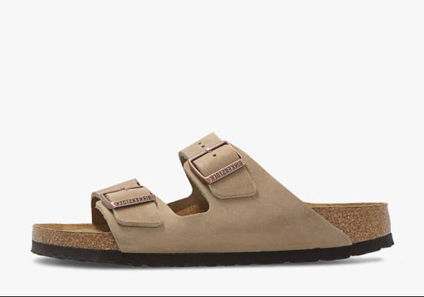 Brown sandal with cork sole on a white background