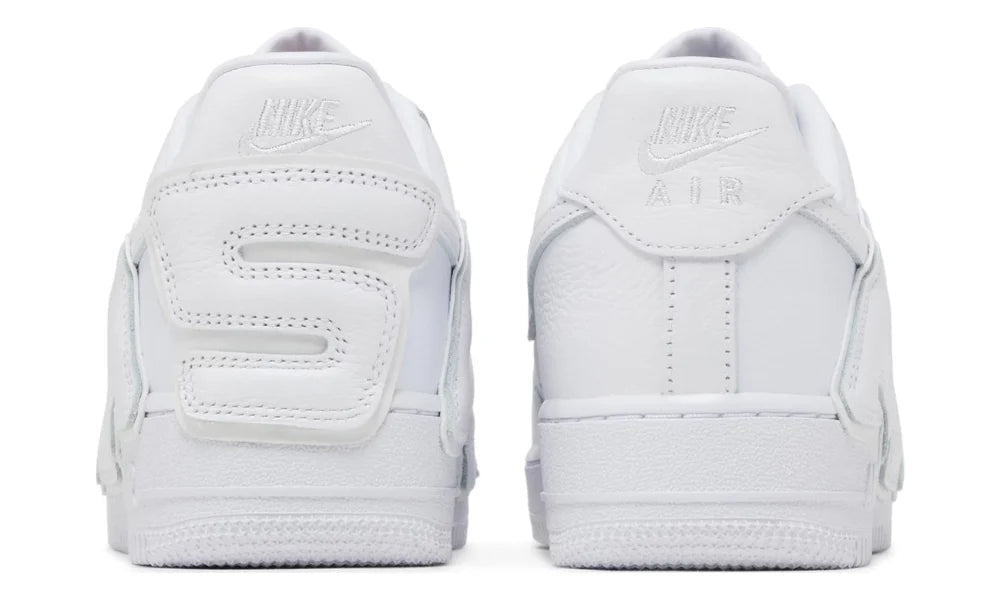 White Nike sneakers shown from the back on a white background