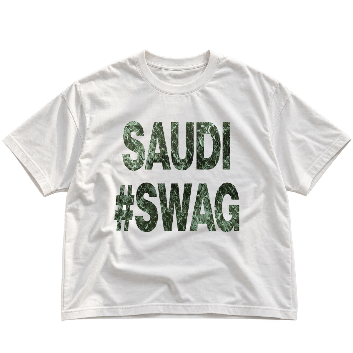 A white short-sleeve crewneck t-shirt with 'SAUDI #SWAG' printed on the front in a green camouflage pattern, shown against a plain white background.